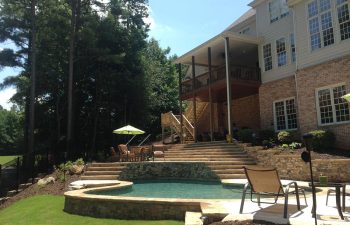 A big residential house with a swimming pool in the garden.