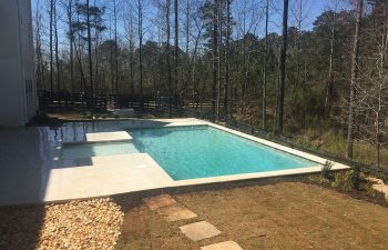 Home with modern pool in the backyard