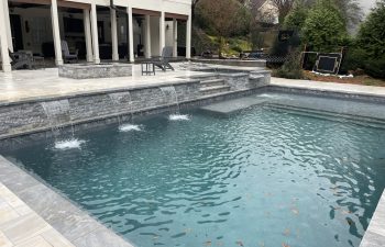 A residential house with an outdoor swimming pool installed by Premier Pool Enterprises