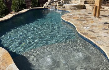 Backyard swimming pool of irregular shape