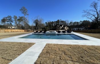 Backyard swimming pool installed by Premier Pool Enterprises